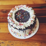 An ice cream cake, shown with sprinkles